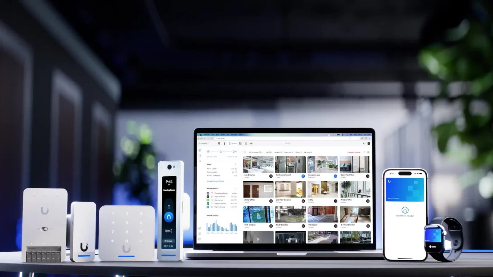 UniFi Access door readers and an intercom beside a laptop, phone and watch showing the Access app