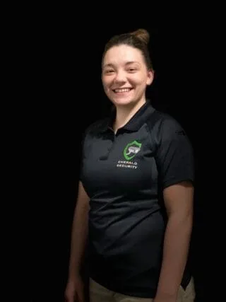 Ginger “Jade” Fulcher in an Emerald Security polo shirt